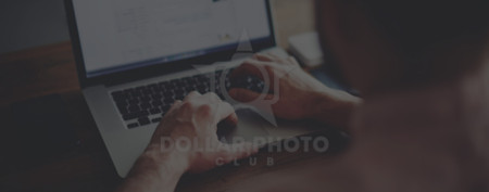 man working on laptop looking at scorm player